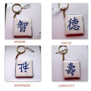 Cross Stitch Key Chains Depicting Various Chinese Symbols