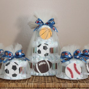 Sports themed diaper cake centerpiece and four smaller cakes