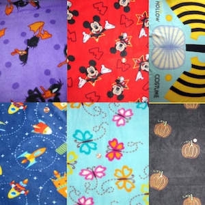 May include: A collage of ten different fabric swatches featuring various patterns. The swatches include a purple fabric with black ducks, a red fabric with Mickey Mouse, a blue fabric with rockets, a blue fabric with butterflies, a black fabric with orange pumpkins, a blue and yellow fabric with a bee costume, a yellow and black striped fabric, a red and white fabric with a star, a blue and white fabric with a star, and a blue and white fabric with a star.