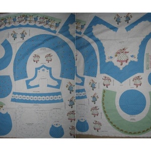 May include: A fabric pattern sheet with blue and green accents featuring a bunny rabbit design. The sheet includes multiple patterns for sewing a bunny rabbit themed project. The text on the sheet reads "Bunny Hop Accessory Panel".
