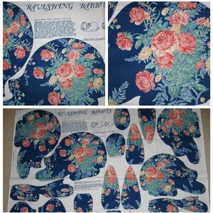 May include: A fabric pattern for a plush toy rabbit. The pattern is printed on white fabric and features a blue background with a floral design. The pattern includes instructions for making the toy, as well as a small illustration of the finished product. The text on the pattern reads "Ravishing Rabbits".