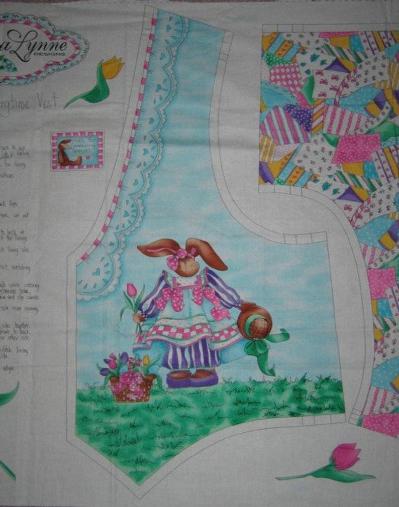 May include: A blue and white fabric panel with a bunny holding a basket of flowers. The bunny is wearing a pink and white dress with purple stripes. The fabric panel is part of a quilting pattern called "Springtime Vest" by LaLynne Designs.
