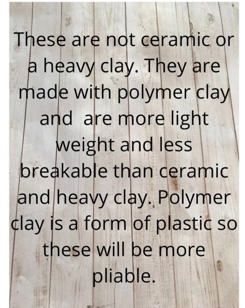 May include: Text on a woodgrain background explaining that the items are made with polymer clay, which is a form of plastic, making them lighter and more pliable than ceramic or heavy clay.