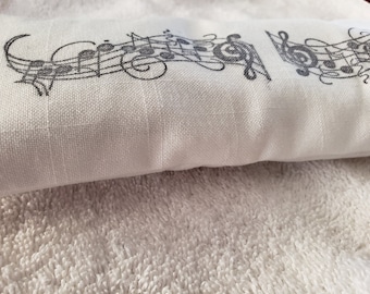 Soothing Lavender flaxseed eye pillow, hand stamped white bleached broadcloth fabric, Music staff design, black ink, relaxation.
