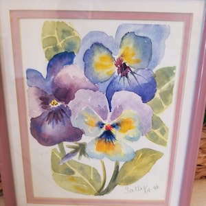 May include: Framed watercolour painting of three purple, blue, and yellow pansies with green leaves. The painting is signed "Sallee '96".