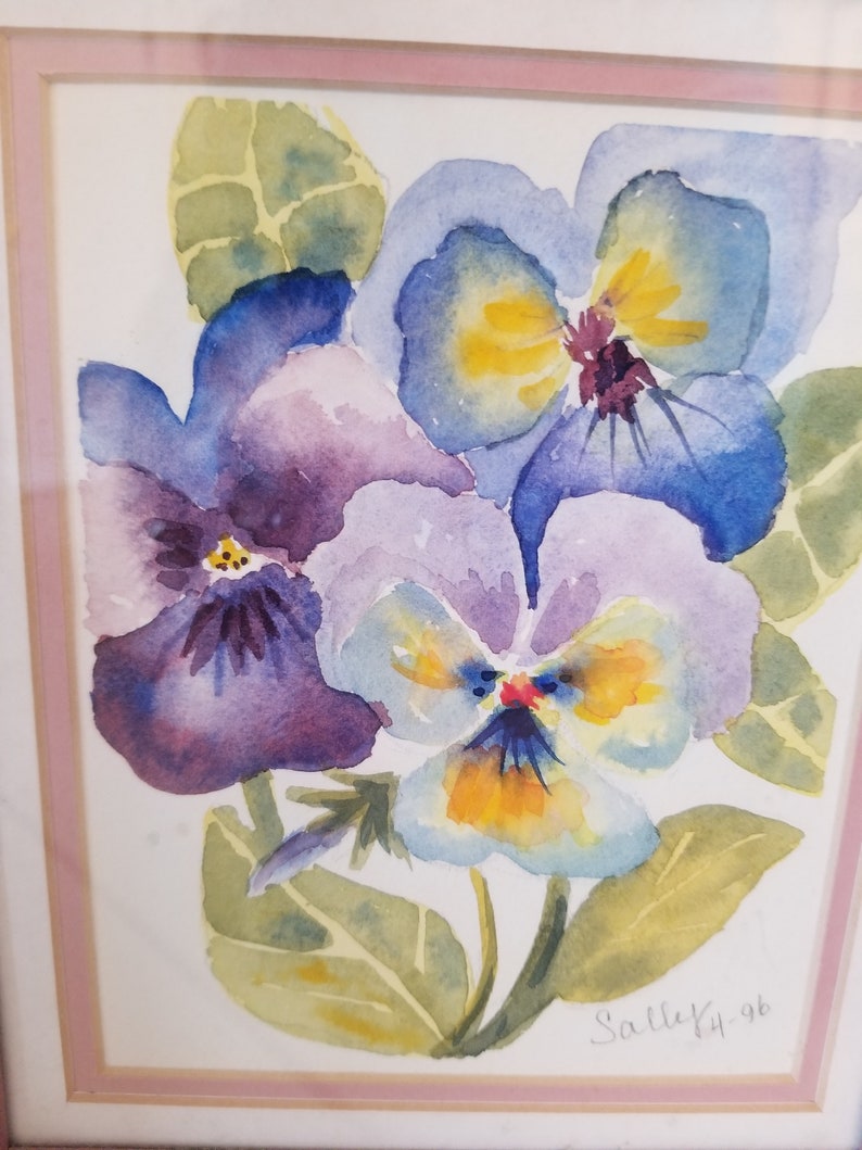 May include: Watercolour painting of three purple, blue and yellow pansies with green leaves. The painting is signed "Salleky 96".