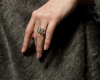 Studded silver statement ring with spikes