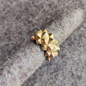 Studded gold statement ring with spikes