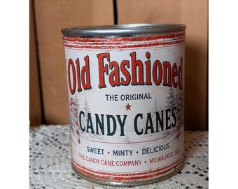Bastones de caramelo navideños de estilo antiguo, lata de pinta inspirada en el estilo vintage oxidado