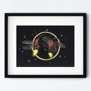 May include: Framed artwork featuring two fireflies with glowing yellow abdomens, set against a black background. The fireflies are positioned within a gold-colored circle, with additional green dots scattered around.