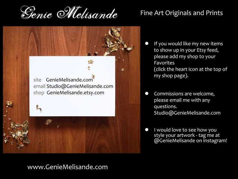 May include: A white card with the text "Genie Melisande" in a cursive font. The card also includes the website, email, and shop information for the artist. The card is on a wooden surface with gold leaf accents.