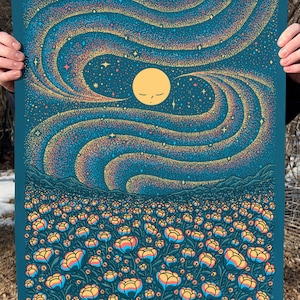 May include: A rectangular art print featuring a field of stylized flowers in shades of yellow, orange, and blue under a dark teal night sky. A central yellow moon with closed eyes is surrounded by swirling, stippled patterns of colorful stars.