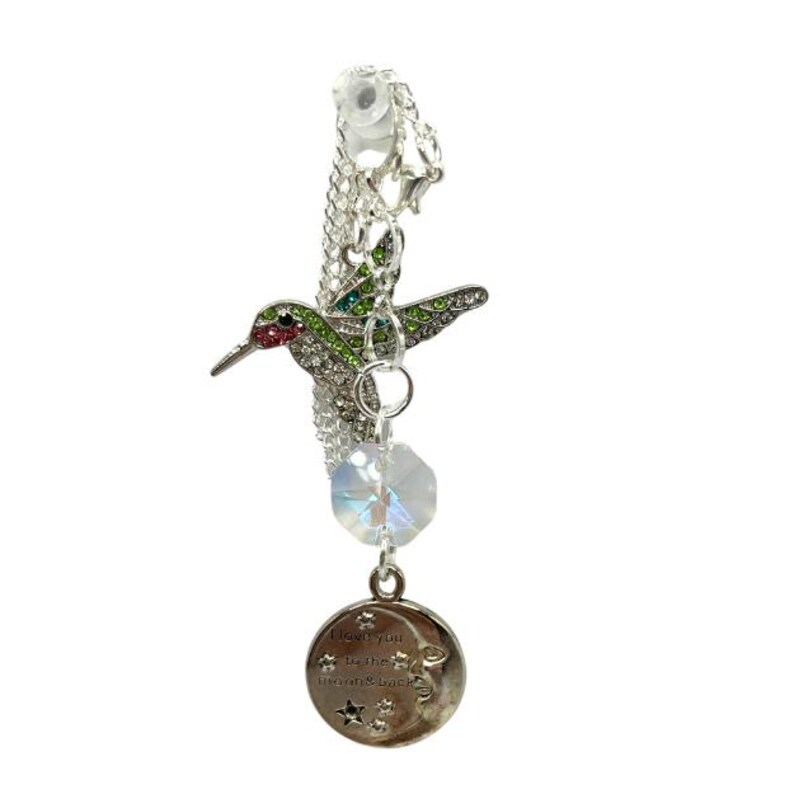 May include: Silver charm bracelet with a green and red jeweled hummingbird, a clear crystal, and a silver charm with the text "I love you to the moon & back".