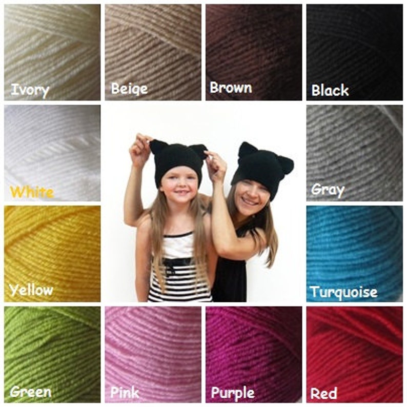 May include: A selection of yarn colors in skeins, including ivory, beige, brown, black, white, gray, yellow, turquoise, green, pink, purple, and red. The yarn is shown in a grid format with a photo of two people wearing cat ear hats in the center.