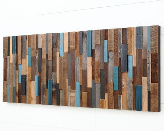 May include: A large rectangular wall art piece made of reclaimed wood. The wood is arranged in a random pattern and painted in shades of brown, blue, and gray.