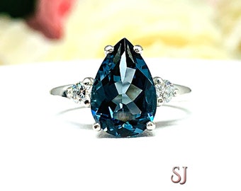 London Blue Topaz Pear Round Moissanite Accents Sterling Silver Ring