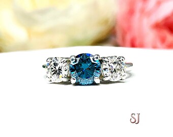 Round London Blue Moissanite Three Stone Sterling Silver Ring