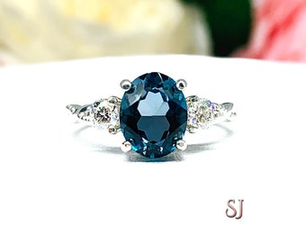 Oval London Blue Topaz with Moissanite Accents Ring