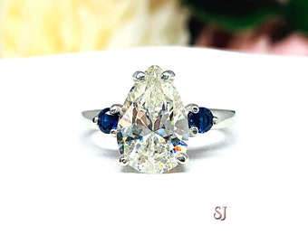 Pear Near Colorless Cubic Zirconia Lab Blue Sapphire Accents Engagement Ring