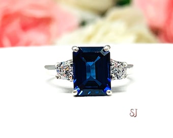 Lab Blue Sapphire Emerald Cut Round CZ Accents Ring