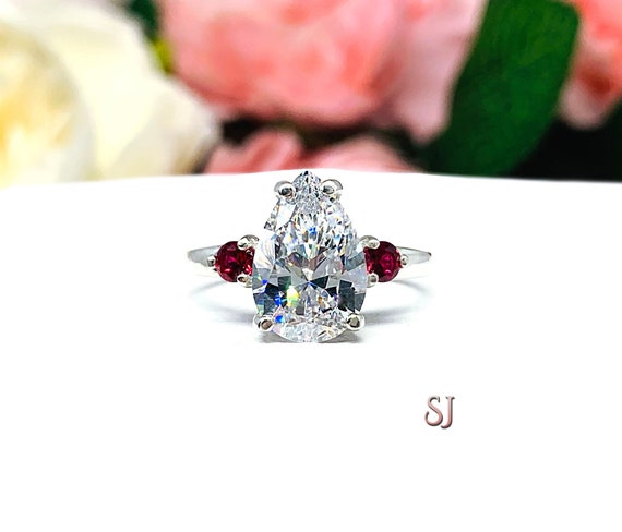 16.0x11.25 mm Radiant Cut Created Ruby and 6 ctw Trapezoid Lab Grown Diamond  Engagement Ring with Side Accents - Grownbrilliance