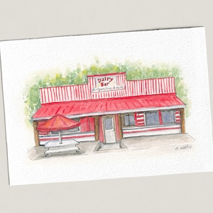 May include: Watercolor painting of a red and white striped Dairy Bar with a red awning and a matching umbrella over a picnic table. The sign reads "Dairy Bar Burgers Fries & More".