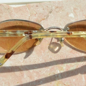 May include: A set of three ceramic mugs with a speckled, matte finish. The mugs are in shades of cream, light gray, and dark gray. Each mug has a simple, minimalist design, perfect for coffee or tea.