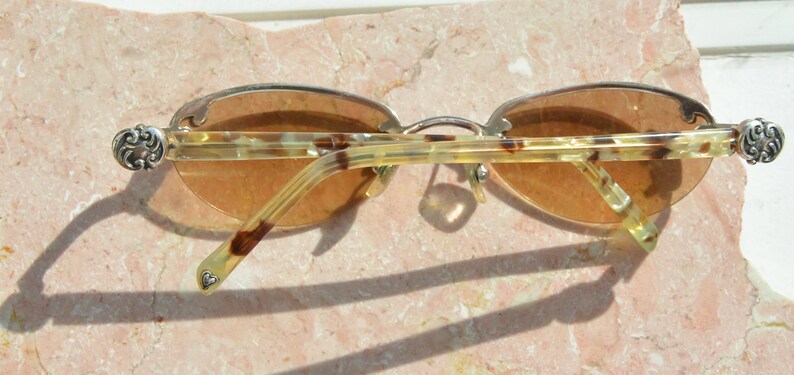 May include: A set of three ceramic mugs with a speckled, matte finish. The mugs are in shades of cream, light gray, and dark gray. Each mug has a simple, minimalist design, perfect for coffee or tea.