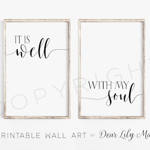 May include: Two framed prints with black calligraphy on a white background. The first print says "It is well" and the second print says "With my soul".