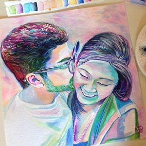 May include: A watercolour painting of a couple in a close embrace. The man is wearing glasses and has a beard. The woman is smiling and has long dark hair. The painting is done in a soft, pastel colour palette.