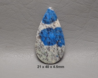 May include: A teardrop-shaped gemstone with a blue and white pattern. The stone measures 21 x 40 x 4.5mm. The blue sections have a mottled appearance, while the rest of the stone is a mix of white and gray.