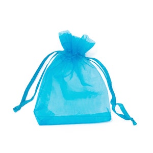 May include: A light blue sheer drawstring bag made of organza fabric. The bag is empty and ready to be filled with small gifts or favors.