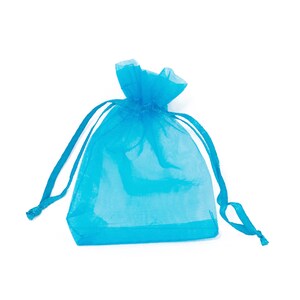 May include: A light blue sheer drawstring bag made of organza fabric. The bag is empty and ready to be filled with small gifts or favors.
