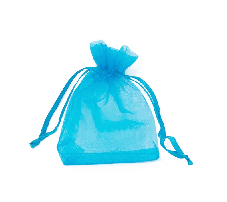 May include: A light blue sheer drawstring bag made of organza fabric. The bag is empty and ready to be filled with small gifts or favors.