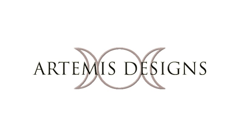May include: A logo for a business called "ARTEMIS DESIGNS" featuring a triple moon symbol in a light gray color.