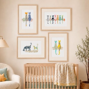 May include: Four framed wall art prints featuring stylized cat illustrations. The top left shows two cats sitting, the top right displays a row of eight cats, the bottom left depicts two walking cats, and the bottom right shows two cats sitting together.
