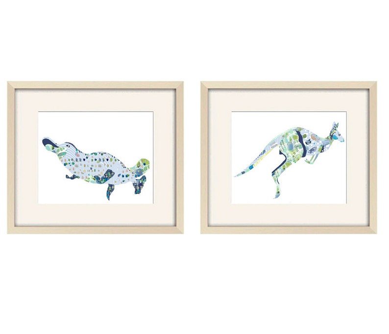 May include: Two framed prints of Australian animals. The left print features a blue and green platypus. The right print features a blue and green kangaroo.