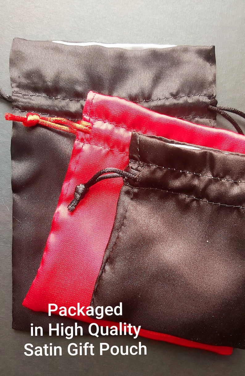 May include: Two satin gift pouches, one black and one red, with drawstrings. The pouches are stacked on top of each other. The text "Packaged in High Quality Satin Gift Pouch" is printed on the bottom of the image.