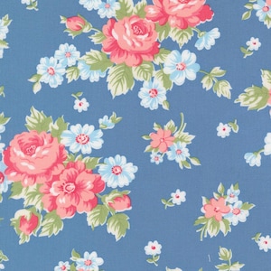 May include: Blue floral fabric featuring pink roses, small white flowers, and light blue flowers with green foliage. The repeating pattern is suitable for various craft projects. The fabric is ideal for quilting or dressmaking.