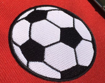 May include: White and black embroidered soccer ball patch. The patch is on a red background.