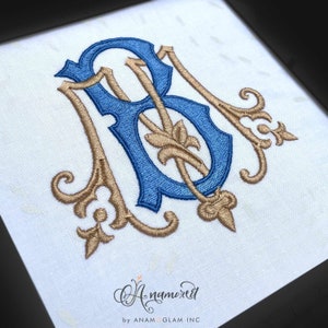 May include: A blue and gold embroidered monogram with the letters "B" and "B" intertwined. The monogram is in a traditional style with ornate flourishes.