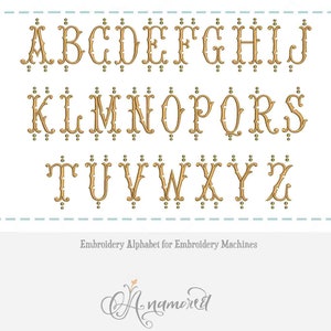 May include: A gold alphabet embroidery design for embroidery machines. The letters are in a decorative, vintage style with ornate details. The letters are A-Z.