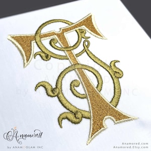 May include: Gold embroidered monogram featuring the letters "T" and "S" intertwined with ornate flourishes. The design is set against a white background, showcasing the detailed stitching and elegant style. The Etsy shop name "Anamored" is at the bottom.