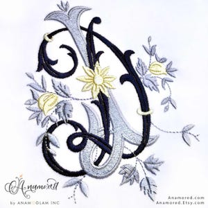 May include: Embroidered letter "A" in navy blue, silver, and yellow, with floral accents. The design features a stylized flower and leaves, set against a white background. The Etsy shop name "Anamored" is at the bottom.