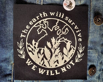May include: A black patch with the text "The earth will survive, we will not" in white, surrounded by a white outline of the earth and foliage. The patch is on a denim jacket, with three white buttons that read "unionize your workplace", "L+J", and "Rent is theft".