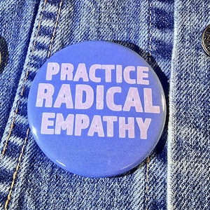 May include: A blue button with the text "PRACTICE RADICAL EMPATHY" in pink lettering.