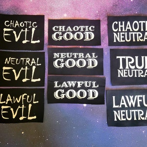 May include: Nine black fabric patches with white text. The patches are labeled with alignment and good/evil combinations: Chaotic Evil, Chaotic Good, Chaotic Neutral, Neutral Evil, Neutral Good, True Neutral, Lawful Evil, Lawful Good, Lawful Neutral.