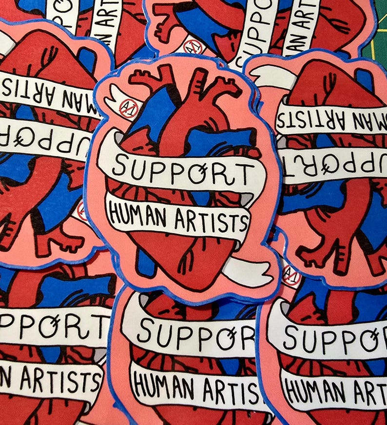 Op de afbeelding: Een verzameling stickers met een gestileerd anatomisch hartontwerp. Het hart is rood en blauw, omlijnd in zwart, met een banner met de tekst "SUPPORT HUMAN ARTISTS". De stickers hebben een roze achtergrond.