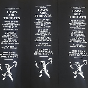 Écusson de bannière sur la manche Les lois sont des menaces