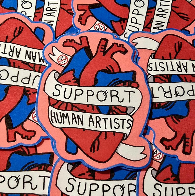 Op de afbeelding: Een verzameling stickers met een gestileerd anatomisch hartontwerp in rood en blauw, omlijnd in roze. Een witte banner over het hart leest "SUPPORT HUMAN ARTISTS". De achtergrond is gevuld met vergelijkbare stickers.